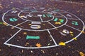 Snail Hopscotch or Escargot Street Children`s Game. Hopscotch drawn on the asphalt in the city park.