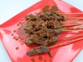 Snail satay sate bekicot on the red plate