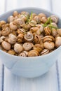 Snails in blue bowl Royalty Free Stock Photo