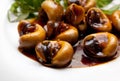 Snails cooked in tamarind sauce with herbs