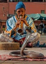 Snake charmer playing music, Marrakech, Morocco