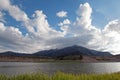 Snake River and Central Rocky Mountains under cumulus cloud sky in Alpine Wyoming Royalty Free Stock Photo