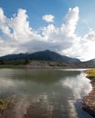 Snake River and Central Rocky Mountains under cumulus cloud sky in Alpine Wyoming Royalty Free Stock Photo