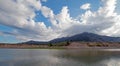 Snake River and Central Rocky Mountains under cumulus cloud sky in Alpine Wyoming Royalty Free Stock Photo