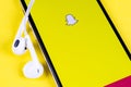 Snapchat application icon on Apple iPhone X smartphone screen close-up. Snapchat app icon. Social media icon. Social network Royalty Free Stock Photo