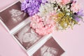 A snapshot of an ultrasound scan and flowers on a pink background pregnancy and motherhood concept, conscious parenthood