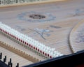 Snares inside body of old harpsichord with bridge