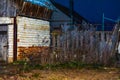 Snatched out of the darkness, a hastily folded shed still leaves hope for the inhabitants of this site. `Hope dies last.` Royalty Free Stock Photo