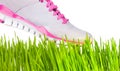 Sneaker stepping on grass