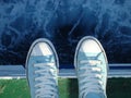 Sneakers above the sea Royalty Free Stock Photo