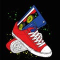Sneakers and audiocassette. Music and shoes. Retro, vintage, 80s and 90s.