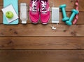 Sneakers dumbbells bottle of water and measure tape Royalty Free Stock Photo