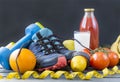 sneakers , dumbbells ,oranges, tomatoes, lemon, sports bracelet, tomato juice , milk, fruits and vegetables