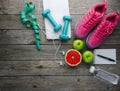 Sneakers dumbbells pomelo bottle of water apple and measure tape o Royalty Free Stock Photo