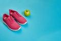 Sneakers, green apple, weight loss, running, healthy eating, healthy lifestyle concept Royalty Free Stock Photo