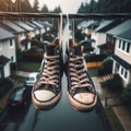 Sneakers hanging from telegraph wire