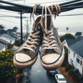 Sneakers hanging from telegraph wire