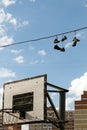 Sneakers Hanging on a Telephone Line Royalty Free Stock Photo