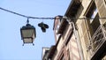 Sneakers are hung on wires. Action. Sneakers hanging from cable wires on background of house and blue sky. Bullies had