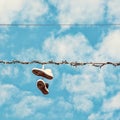 Sneakers on the power line, beauty filter Royalty Free Stock Photo