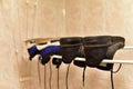 Sneakers to dry in the bathroom after washing. Two pairs shoes dry after wash.  Footwear on heated towel rail to dry Royalty Free Stock Photo