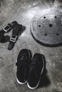 sneakers with wrist wraps and weight plate covered with talc Royalty Free Stock Photo