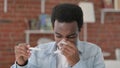 Sneezing sick African Man Checking Temprature