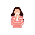 Sneezing woman covers mouth and nose with tissue.