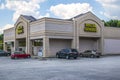 Dollar General store with cars and blue sky and clouds Royalty Free Stock Photo