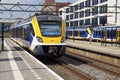 SNG local sprinter commuter train of NS on across tation Den Haag Mariahoeve