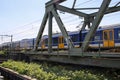 SNG sprinter local commuter train along the rail bridge at Kethel in schiedam Royalty Free Stock Photo
