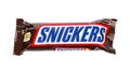 SNICKERS chocolate bar on white background. Snickers is a chocolate bar made by the American company Mars, Incorporated,