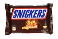Snickers package of chocolate bars. Snickers is a chocolate bar made by the American company Mars, Incorporated, consisting of