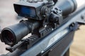 Sniper gun, optics scopes close up. Elements of the sniper rifle with tactical body.  Selective focus Royalty Free Stock Photo