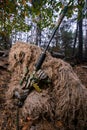 Sniper reload his rifle in forest Royalty Free Stock Photo