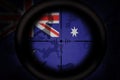 Sniper scope aimed at flag of australia on the khaki texture background. military concept. 3d illustration