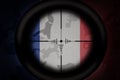 Sniper scope aimed at flag of france on the khaki texture background. military concept. 3d illustration
