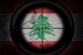 Sniper scope aimed at flag of lebanon on the khaki texture background. military concept. 3d illustration