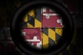 Sniper scope aimed at flag of maryland state on the khaki texture background. military concept. 3d illustration