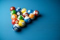 Snooker balls in billiard pyramid on billiard table