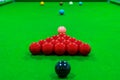 The snooker balls on the table consist of red, black, pink, blue, green, white, brown, and yellow, the focus is on the red ball Royalty Free Stock Photo