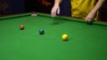 Snooker. close-up . male hands with cue playing billiards