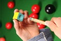 Snooker cue, chalk and hands Royalty Free Stock Photo