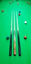 Snooker cue or cues on green baize cloth table Royalty Free Stock Photo