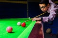 Snooker player placing the cue ball for a shot Royalty Free Stock Photo