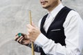 Snooker player standing waiting hold his cue Royalty Free Stock Photo