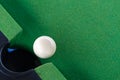 Snooker white ball near the hole on green snooker table Royalty Free Stock Photo
