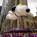 Snoopy balloon floats in the air during the annual Macy`s Thanksgiving Day parade along Avenue of Americas