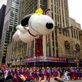 Snoopy balloon floats in the air during the annual Macy`s Thanksgiving Day parade along Avenue of Americas