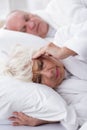 Snoring husband and his wife